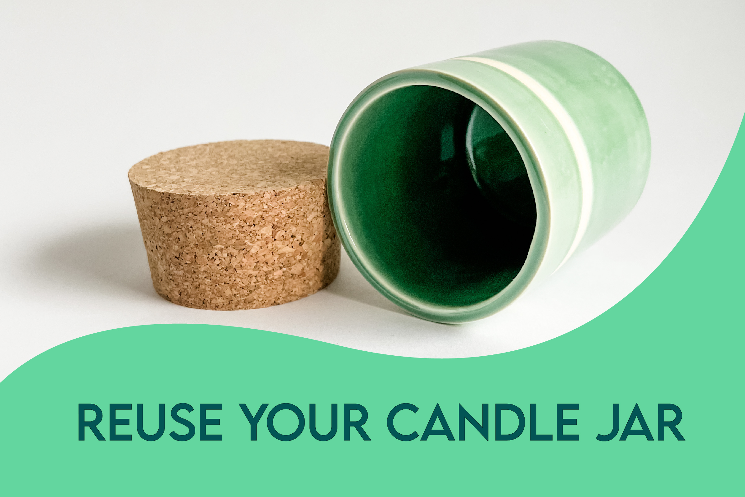 Green ceramic empty candle jar with cork lid. Text on image says reuse your candle jar.