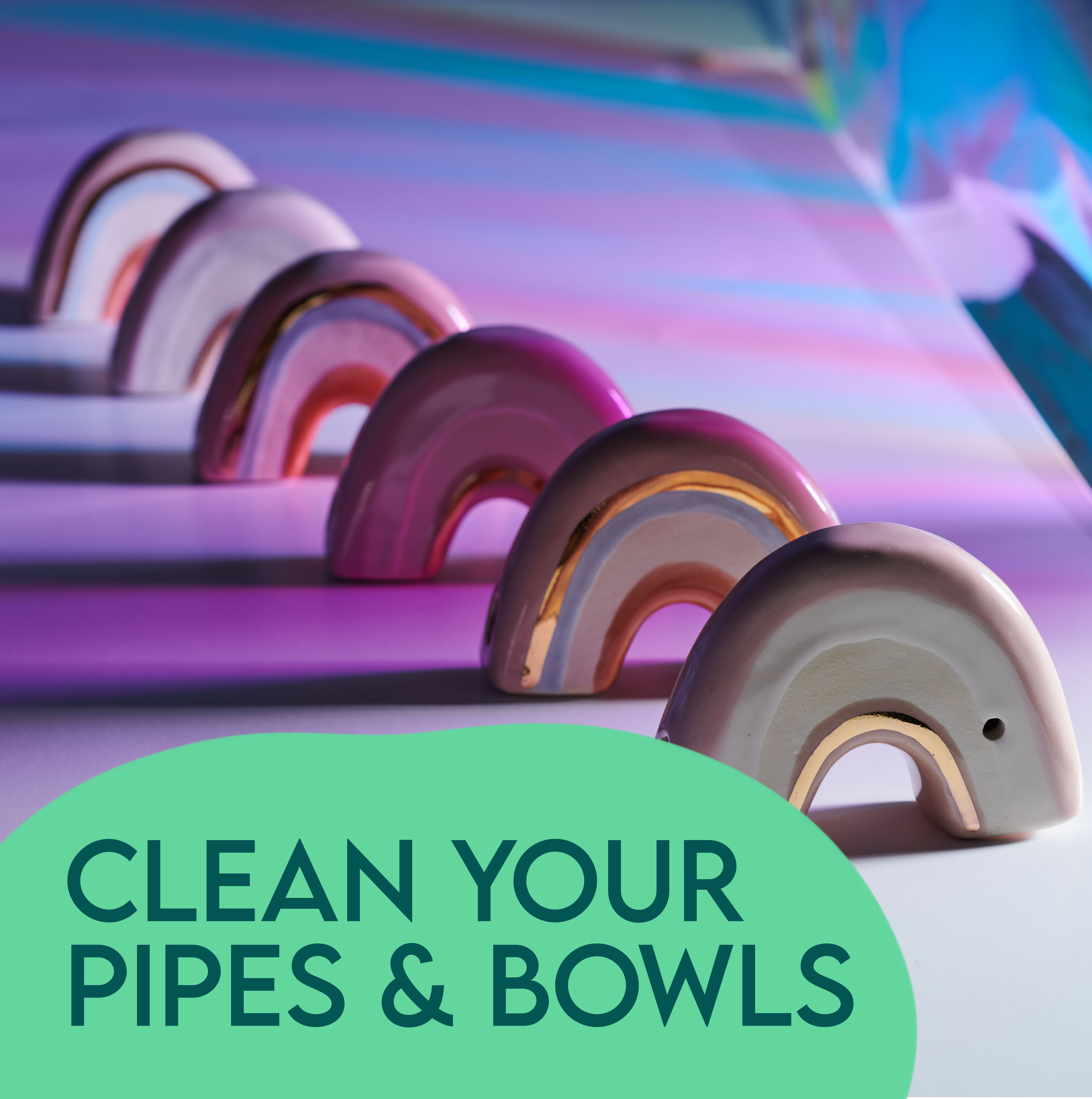Clean Your Ceramic Pipe text with ceramic rainbow pipes in background